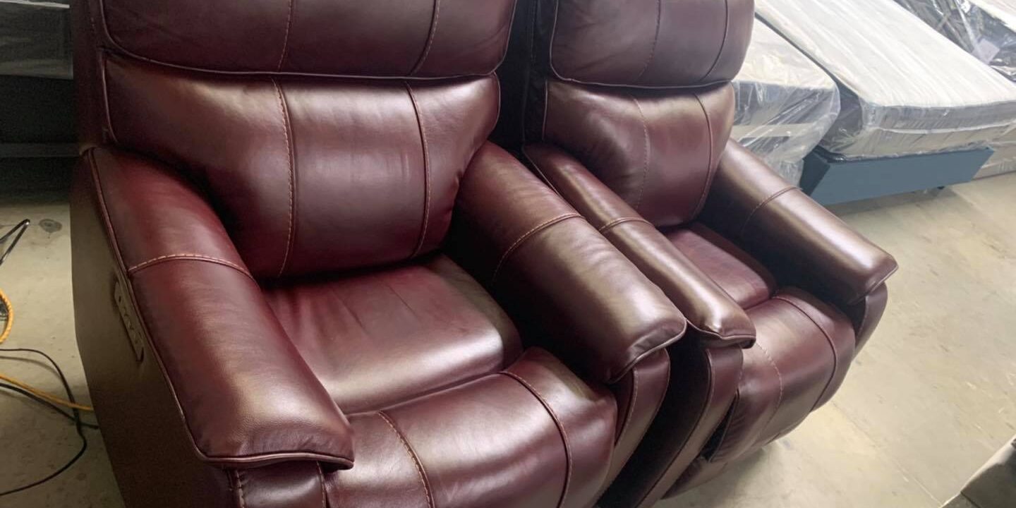 Burgundy leather arm chairs with power recliners, power headrests and USB ports